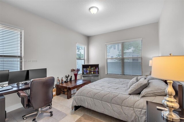 3274 W 96th Pl, Hialeah, FL 33018 - tiled bedroom with an office area