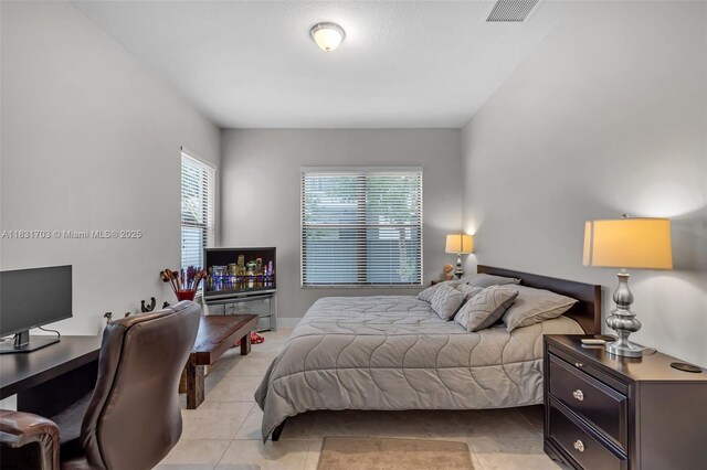 3274 W 96th Pl, Hialeah, FL 33018 - bedroom featuring light tile patterned flooring and an office area
