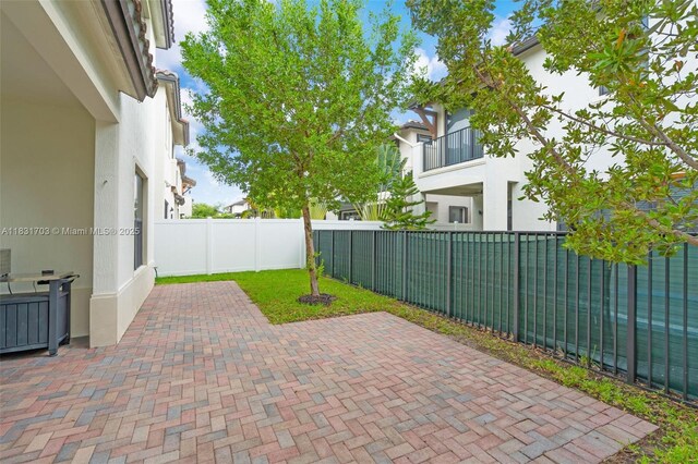 3274 W 96th Pl, Hialeah, FL 33018 - fenced backyard with a patio area