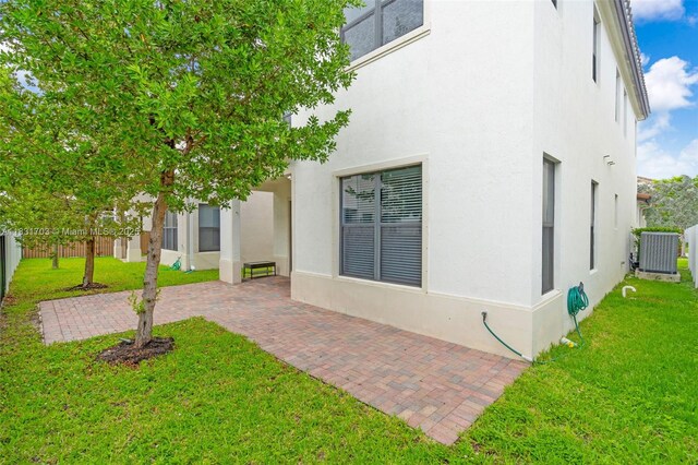 3274 W 96th Pl, Hialeah, FL 33018 - rear view of property featuring stucco siding and a patio area
