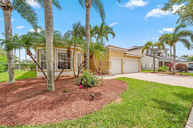 19442 SW 39th St, Miramar, FL 33029 - view of front of property with stucco siding, an attached garage, and driveway