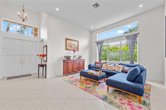 19442 SW 39th St, Miramar, FL 33029 - living room with a towering ceiling, light tile patterned floors, a chandelier, and recessed lighting