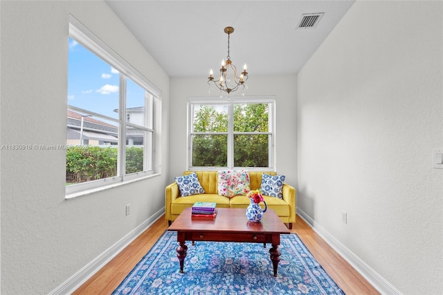 19442 SW 39th St, Miramar, FL 33029 - sitting room with wood finished floors, a chandelier, and a textured wall