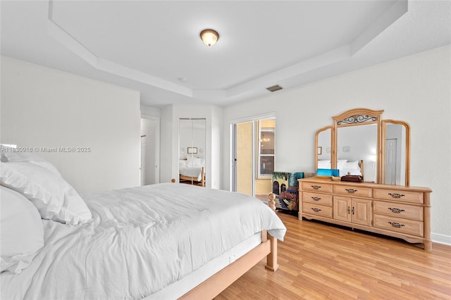 19442 SW 39th St, Miramar, FL 33029 - bedroom featuring a raised ceiling and light wood-style flooring