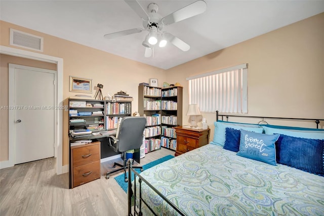 2201 N 57th Ter, Hollywood, FL 33021 - bedroom with wood finished floors, a desk, and ceiling fan