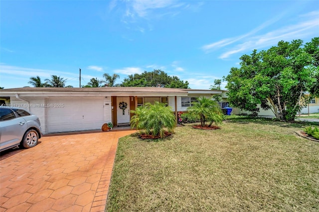 2201 N 57th Ter, Hollywood, FL 33021 - ranch-style home featuring a garage, a front yard, and decorative driveway