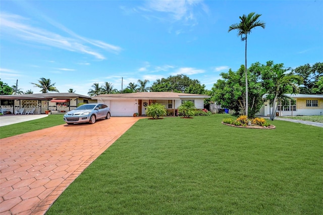 2201 N 57th Ter, Hollywood, FL 33021 - single story home with an attached garage, driveway, and a front yard