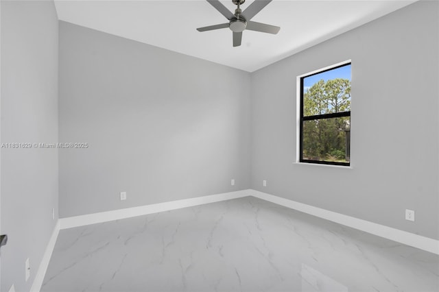 2505 40th, Lehigh Acres, FL 33976 - spare room with marble look tiles and a ceiling fan
