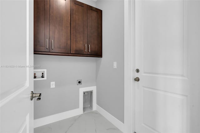 2505 40th, Lehigh Acres, FL 33976 - washroom with cabinet space, hookup for an electric dryer, hookup for a washing machine, and light marble finish flooring