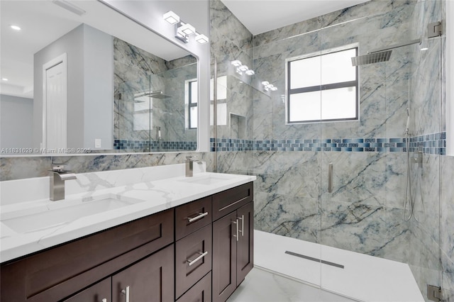 2505 40th, Lehigh Acres, FL 33976 - full bathroom featuring a marble finish shower, double vanity, tile walls, and recessed lighting