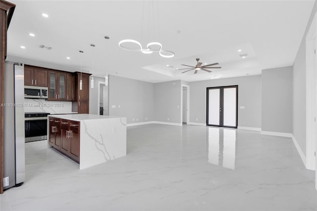 2505 40th, Lehigh Acres, FL 33976 - kitchen featuring appliances with stainless steel finishes, recessed lighting, light marble finish floors, pendant lighting, and a kitchen island