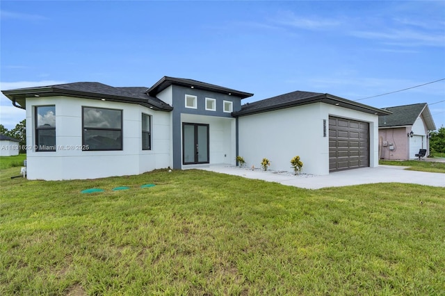 2505 40th, Lehigh Acres, FL 33976 - view of front of home with french doors, stucco siding, a garage, driveway, and a front yard