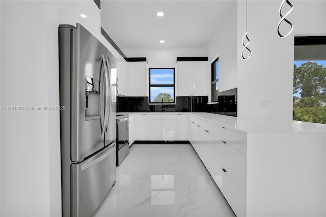 2505 40th, Lehigh Acres, FL 33976 - kitchen featuring stainless steel fridge, modern cabinets, electric range, light marble finish flooring, and recessed lighting
