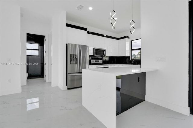 2505 40th, Lehigh Acres, FL 33976 - kitchen with appliances with stainless steel finishes, modern cabinets, light marble finish flooring, white cabinets, and recessed lighting