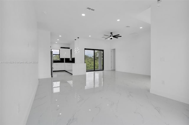 2505 40th, Lehigh Acres, FL 33976 - empty room featuring light marble finish floors, recessed lighting, and a ceiling fan