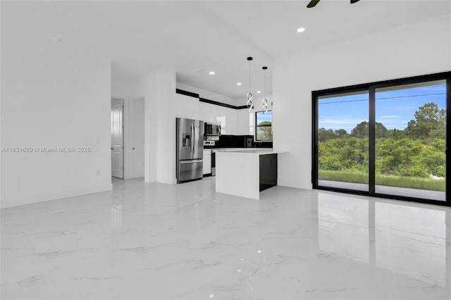 2505 40th, Lehigh Acres, FL 33976 - kitchen with stainless steel refrigerator with ice dispenser, white cabinets, modern cabinets, pendant lighting, and light marble finish flooring