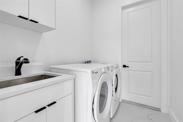 2505 40th, Lehigh Acres, FL 33976 - laundry room with cabinet space, separate washer and dryer, and light marble finish flooring