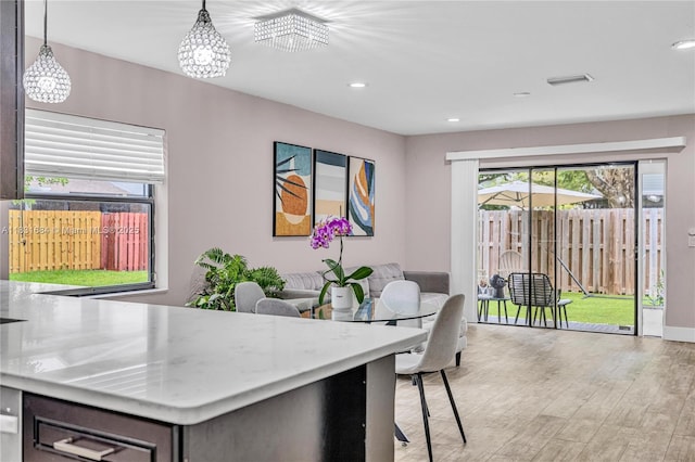 10527 NW 6th St, Pembroke Pines, FL 33026 - dining space featuring light wood-style flooring, recessed lighting, and a chandelier