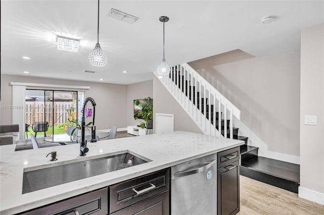 10527 NW 6th St, Pembroke Pines, FL 33026 - kitchen with dishwasher, light wood-style floors, open floor plan, pendant lighting, and light stone counters