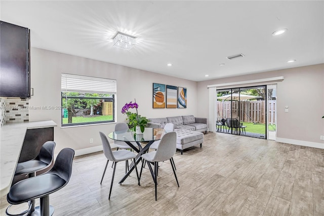 10527 NW 6th St, Pembroke Pines, FL 33026 - dining space with light wood finished floors and recessed lighting