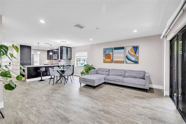10527 NW 6th St, Pembroke Pines, FL 33026 - living area with light wood-type flooring and recessed lighting