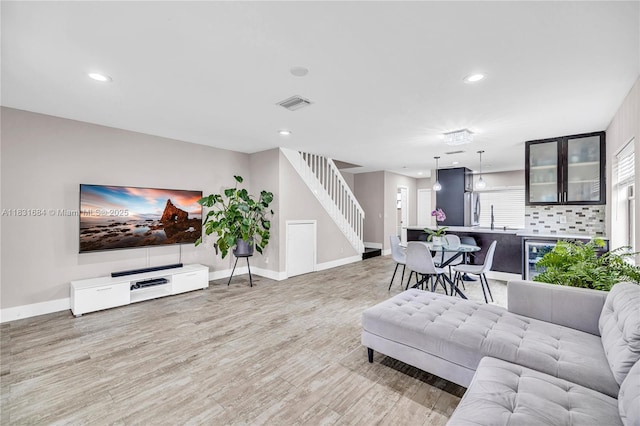 10527 NW 6th St, Pembroke Pines, FL 33026 - living area featuring stairs, wood finished floors, and recessed lighting