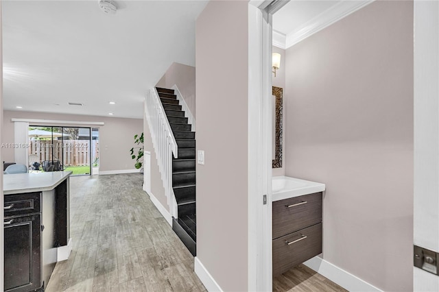 10527 NW 6th St, Pembroke Pines, FL 33026 - corridor featuring stairs, light wood-style flooring, and crown molding