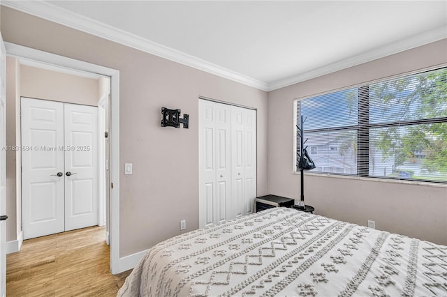 10527 NW 6th St, Pembroke Pines, FL 33026 - bedroom featuring light wood finished floors, ornamental molding, and a closet