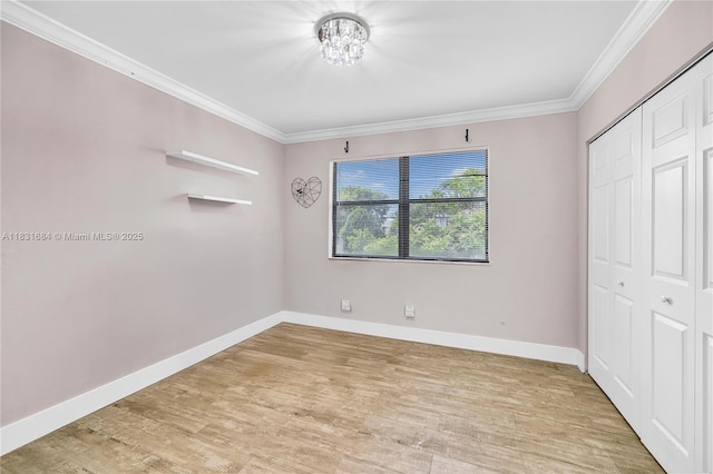 10527 NW 6th St, Pembroke Pines, FL 33026 - unfurnished bedroom with crown molding, light wood-style floors, a closet, and a chandelier
