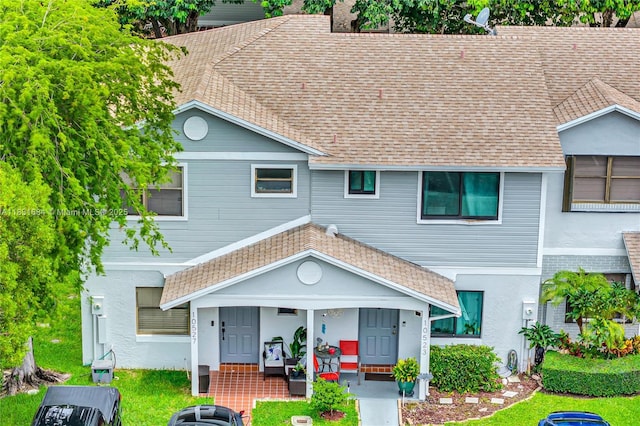 10527 NW 6th St, Pembroke Pines, FL 33026 - view of front of property featuring covered porch, roof with shingles, and a front lawn
