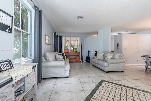 18481 NW 22nd St, Pembroke Pines, FL 33029 - living area featuring light tile patterned flooring and a textured ceiling