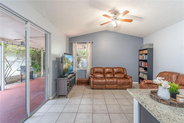 18481 NW 22nd St, Pembroke Pines, FL 33029 - living room with ceiling fan, vaulted ceiling, a textured ceiling, and light tile patterned flooring