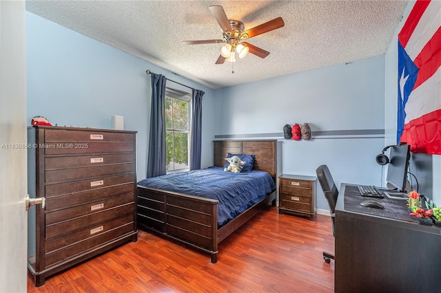 18481 NW 22nd St, Pembroke Pines, FL 33029 - bedroom with a textured ceiling, wood finished floors, and a ceiling fan
