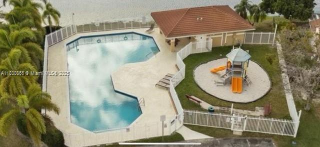 18481 NW 22nd St, Pembroke Pines, FL 33029 - community pool featuring a patio