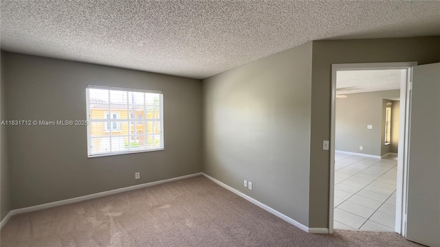 1145 Lake Shore Dr Unit 205, Lake Park, FL 33403 - unfurnished room with a textured ceiling and light carpet