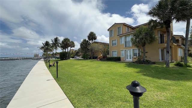 1145 Lake Shore Dr Unit 205, Lake Park, FL 33403 - surrounding community featuring a lawn