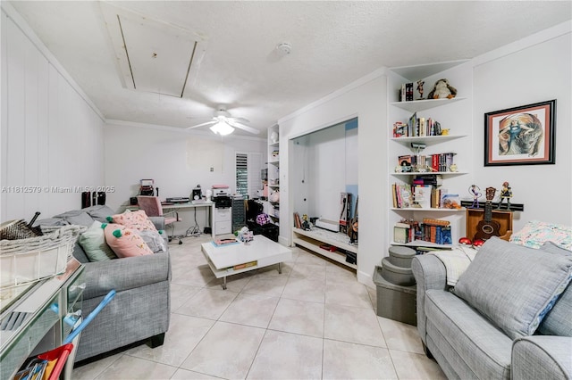 7900 SW Springhaven Ave, Indian Town, FL 34956 - living area featuring attic access, ceiling fan, light tile patterned floors, ornamental molding, and built in features