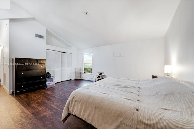 7900 SW Springhaven Ave, Indian Town, FL 34956 - bedroom featuring dark wood-style flooring, high vaulted ceiling, and a closet