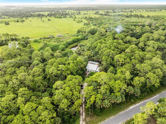7900 SW Springhaven Ave, Indian Town, FL 34956 - aerial view of property and surrounding area with a forest