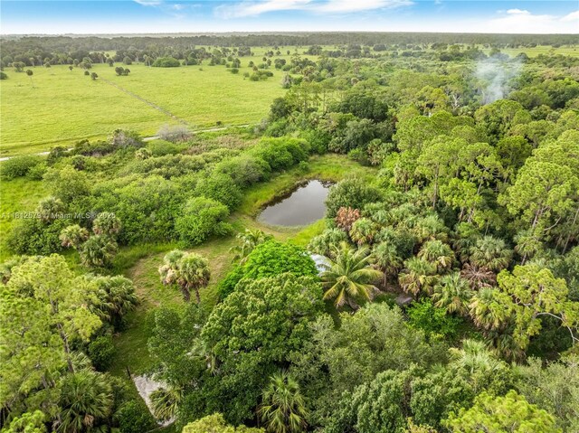 7900 SW Springhaven Ave, Indian Town, FL 34956 - aerial view of property's location featuring a heavily wooded area and a nearby body of water
