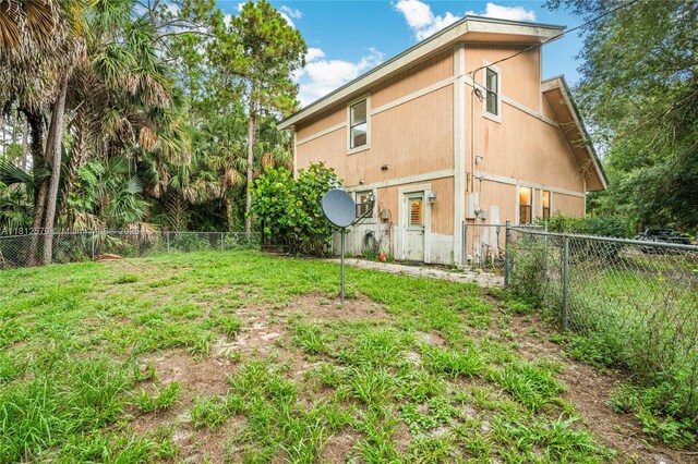 7900 SW Springhaven Ave, Indian Town, FL 34956 - back of house with a fenced backyard