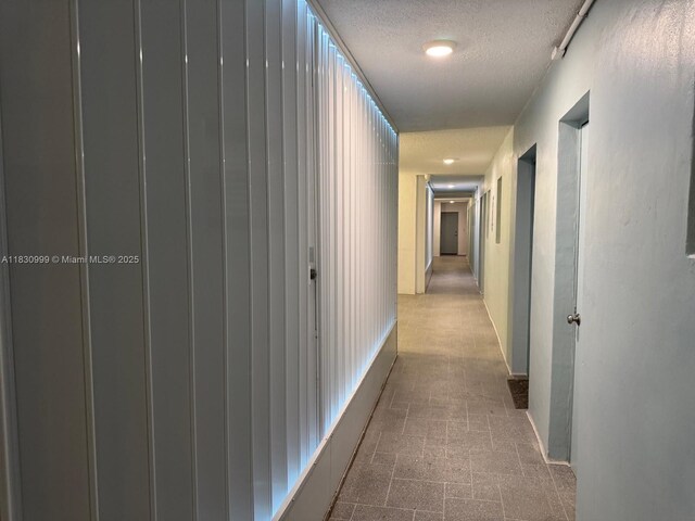 400 N Surf Rd Unit 804, Hollywood, FL 33019 - hall with a textured ceiling and baseboards