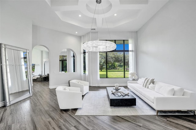11056 Blackhawk Blvd, Davie, FL 33328 - living room featuring coffered ceiling, a towering ceiling, wood finished floors, recessed lighting, and arched walkways