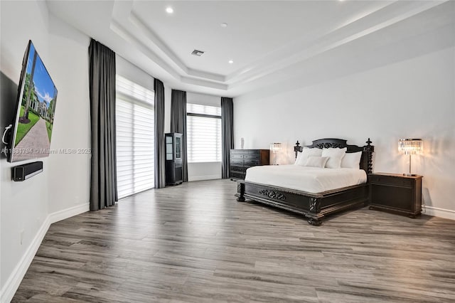 11056 Blackhawk Blvd, Davie, FL 33328 - bedroom featuring a tray ceiling, wood finished floors, and recessed lighting