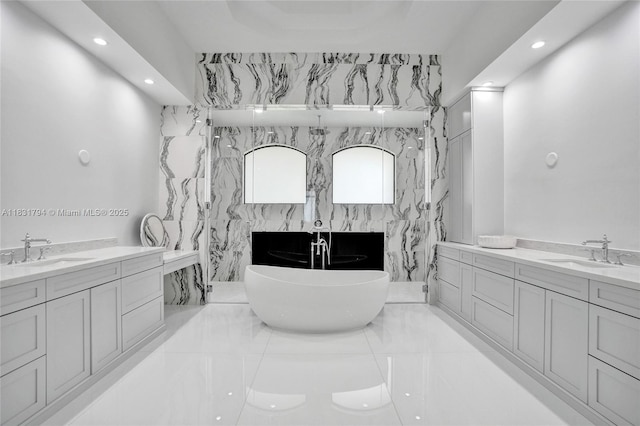 11056 Blackhawk Blvd, Davie, FL 33328 - full bathroom featuring two vanities, recessed lighting, a freestanding bath, and a marble finish shower