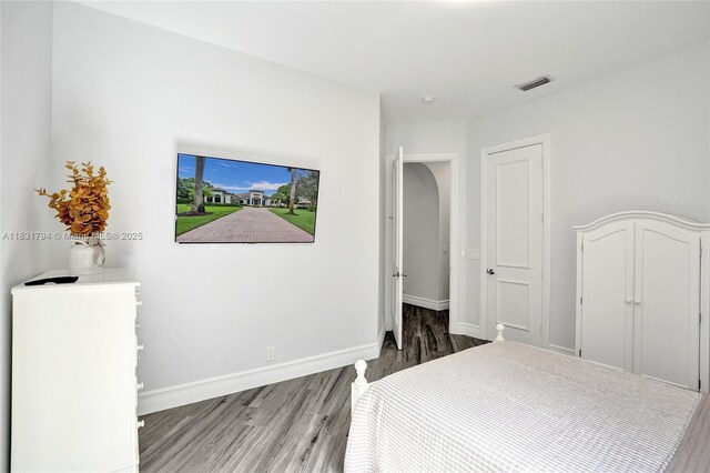 11056 Blackhawk Blvd, Davie, FL 33328 - bedroom featuring wood finished floors and baseboards