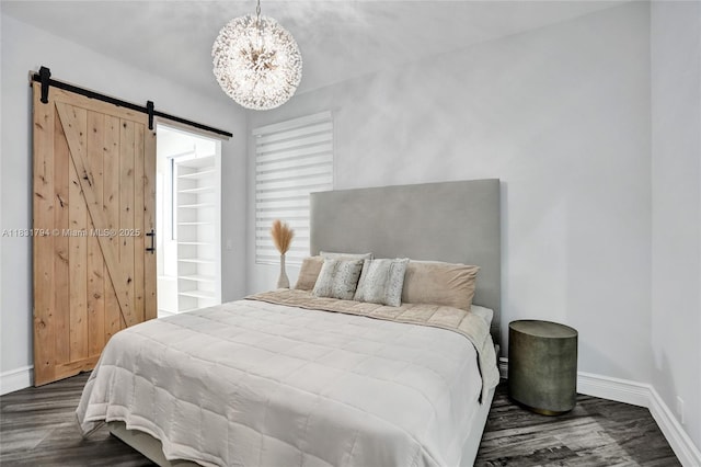 11056 Blackhawk Blvd, Davie, FL 33328 - bedroom with dark wood-type flooring, a chandelier, and a barn door