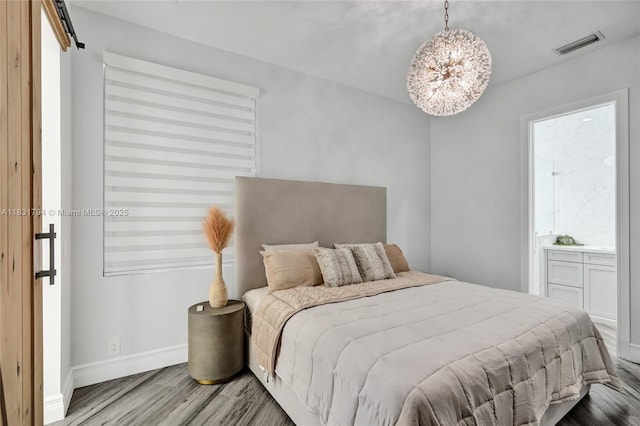 11056 Blackhawk Blvd, Davie, FL 33328 - bedroom with wood finished floors and a chandelier