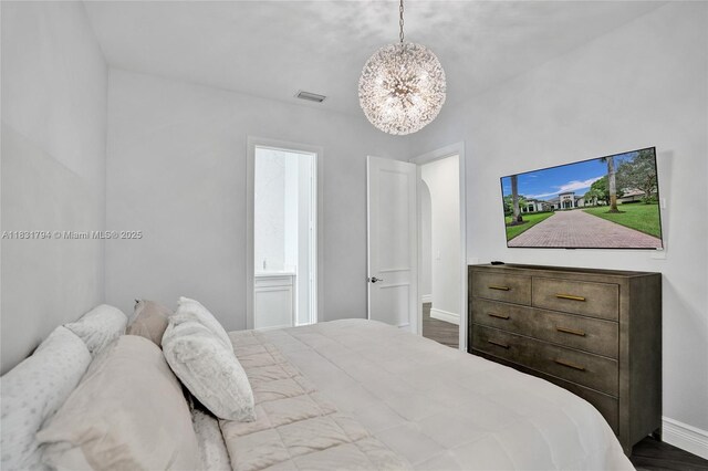 11056 Blackhawk Blvd, Davie, FL 33328 - bedroom featuring a chandelier and dark wood-style floors