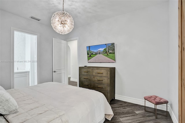 11056 Blackhawk Blvd, Davie, FL 33328 - bedroom featuring dark wood finished floors and a chandelier